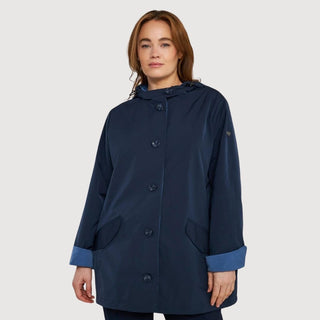 Woman wearing stylish navy coat from Giubbini Outlet collection, perfect for versatile and chic wardrobe updates.