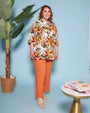 Blusa stile kaftano in tela di viscosa fantasia floreale con scollo a V e spacchi laterali. ARANCIO DORABELLA PIU'