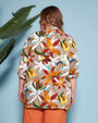 Blusa stile kaftano in tela di viscosa fantasia floreale con scollo a V e spacchi laterali. ARANCIO DORABELLA PIU'