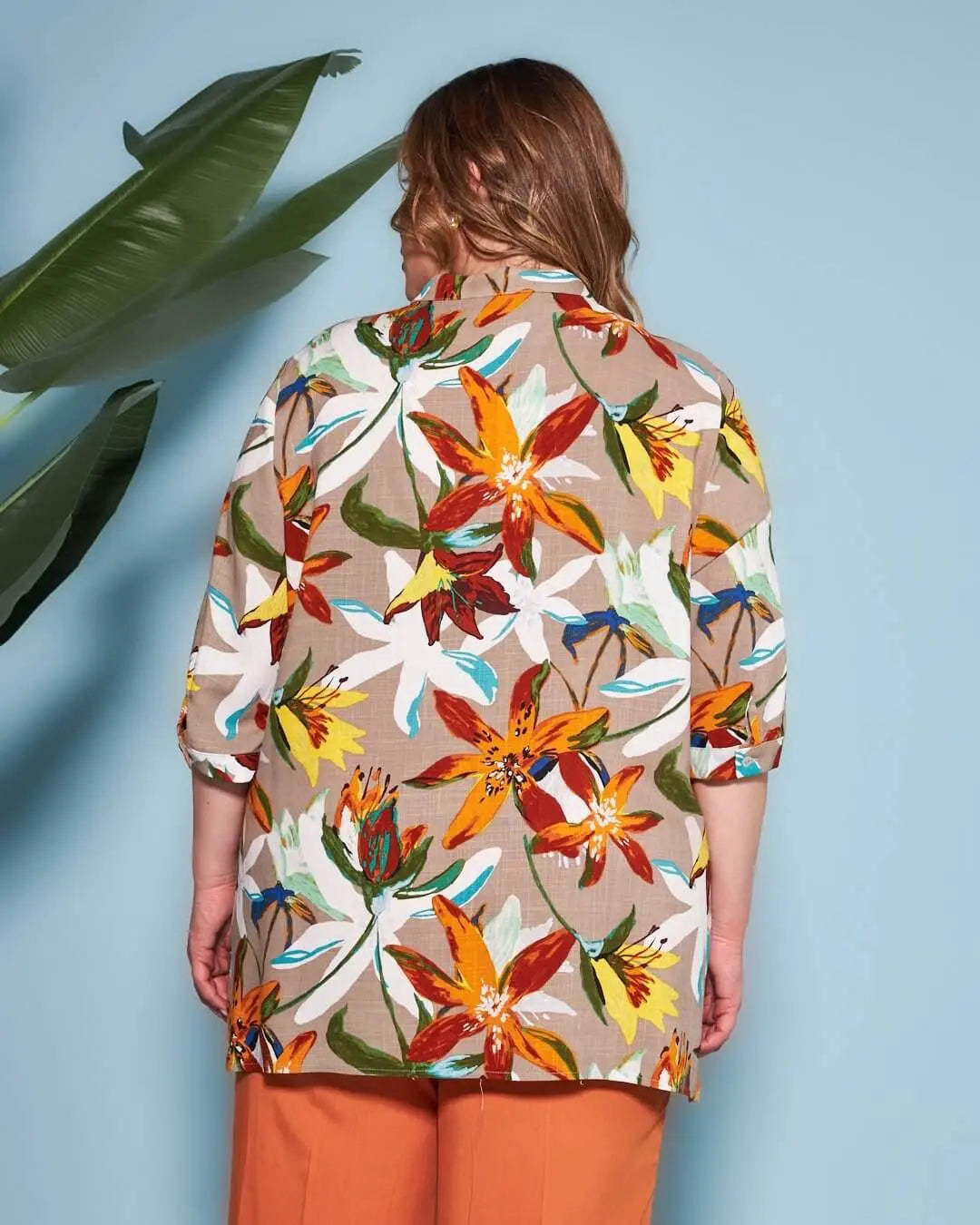 Blusa stile kaftano in tela di viscosa fantasia floreale con scollo a V e spacchi laterali. ARANCIO DORABELLA PIU'