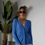 Cardigan scollo a V in maglia di misto viscosa con logo in strass. DORABELLA