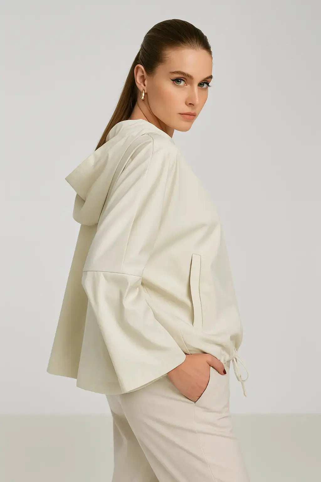 Spolverino con cappuccio in tessuto spalmato Dorabella