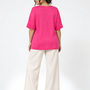 Maglia in filato di viscosa elasticizzata tinta unita con scollo rotondo e maniche kimono. FUXIA - retro