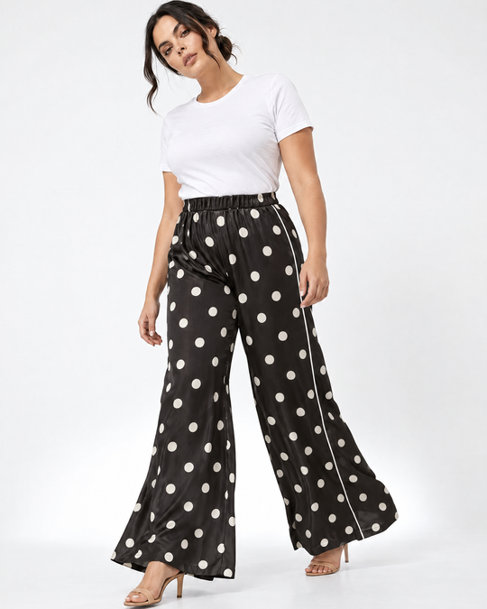 Pantaloni palazzo a pois con piping laterale a contrasto - tre quarti